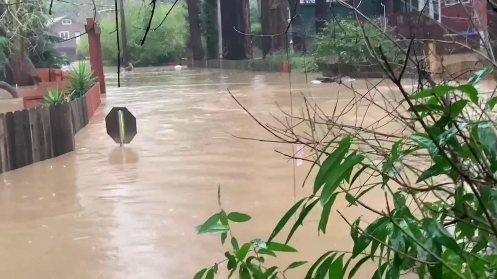 Floodwater as high as a stop sign inundates the community of Felton Grove, due to an atmospheric river is causing a deluge of heavy rain in northern and central California. (Courtesy: Brooks Jarosz / KTVU)