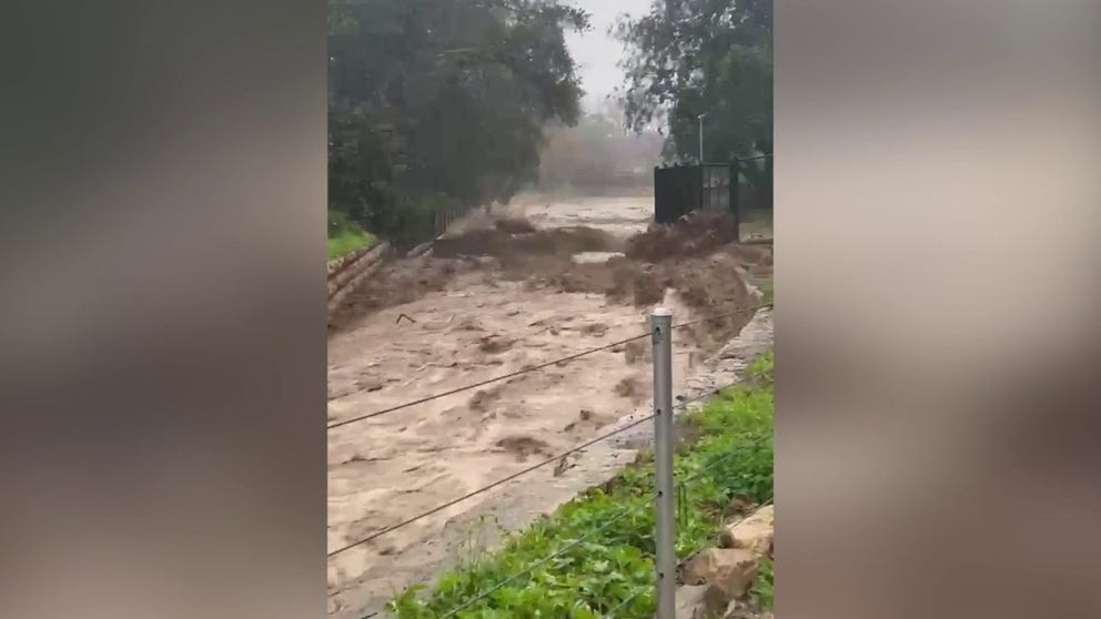 Montecito Creek in Santa Barbara County filled with floodwater, as the region experience heavy rain caused by an atmospheric river. (Courtesy: Josiah Hamilton/Twitter)