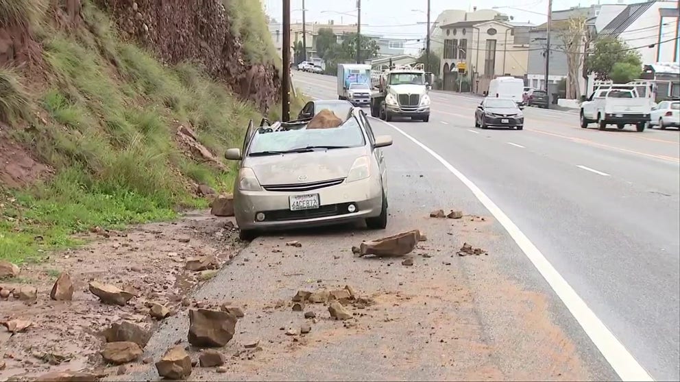 Boulder strikes and damages a vehicle in Malibu, California amid rockslides. All Santa Monica-Malibu Unified School District public schools have closed Tuesday due to weather conditions. (Credit: KTTV) 