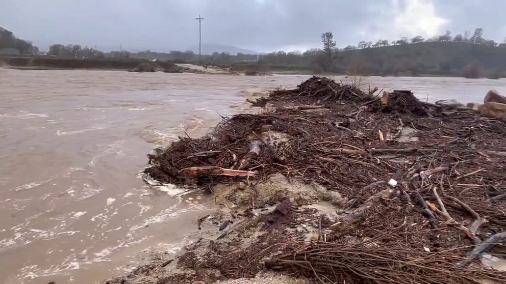 Floodwaters on the Salinas River wash away parts of Halcon Road in Atascadero, California. (Credit: @CalDisasters/ Twitter)