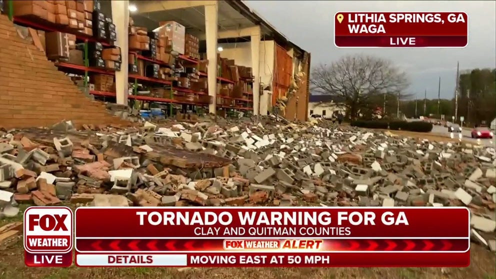 In Lithia Springs, bricks and cement blocks were blown off a warehouse, destroying an entire wall and exposing the inventory inside. Severe weather swept through Georgia on January 12, 2023.