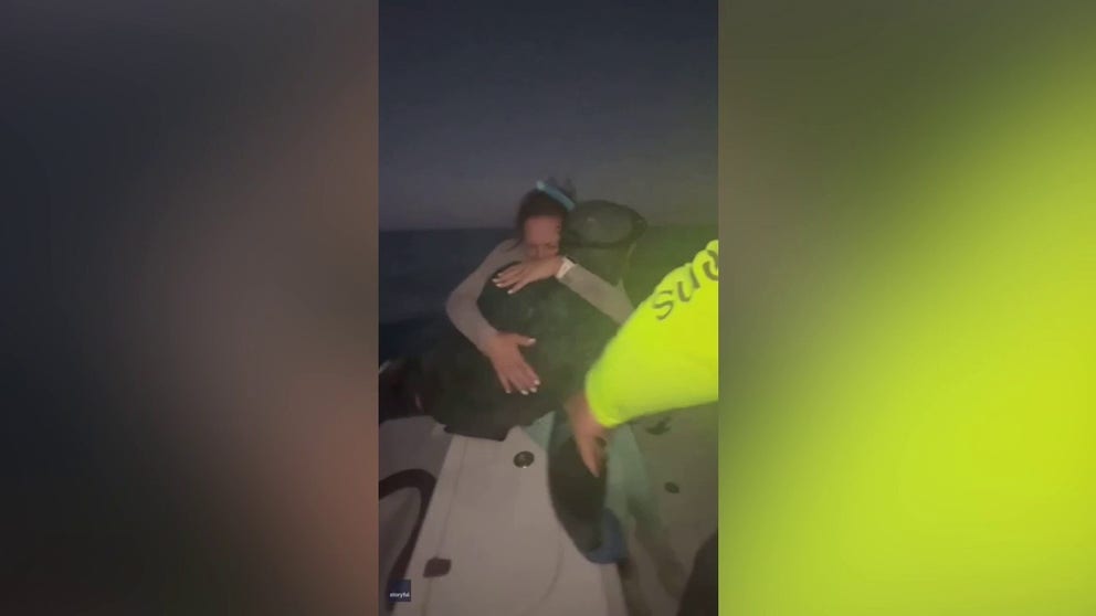 A strong current washed a 22-year-old diver away from his boat. Watch as his family pulls him from the chilly water and hugs the man they feared they lost.