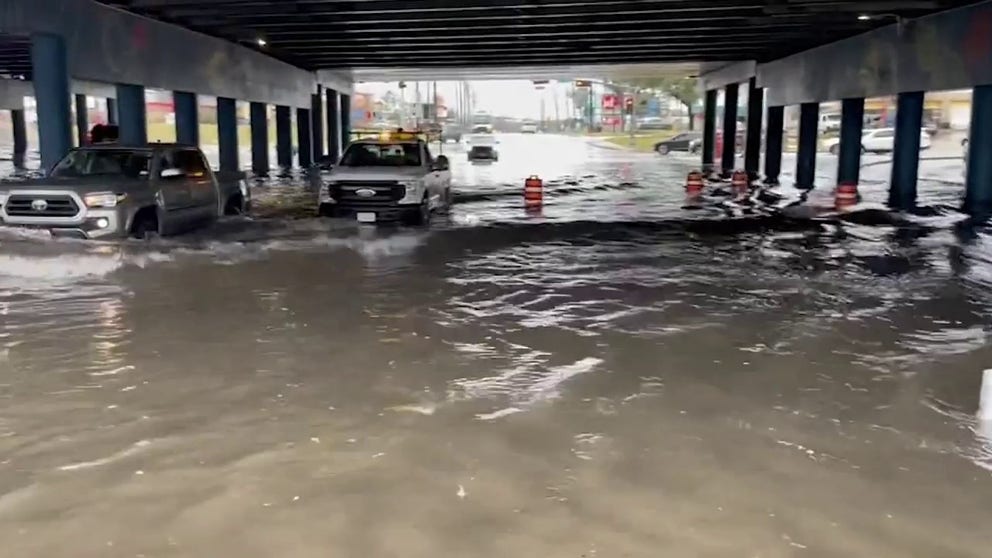 Houston Department of Transportation in Houston captured video of vehicles driving through floodwater in the neighborhood of Wayside. January 24, 2023. (Courtesy: @TxDOTHouston / Twitter)