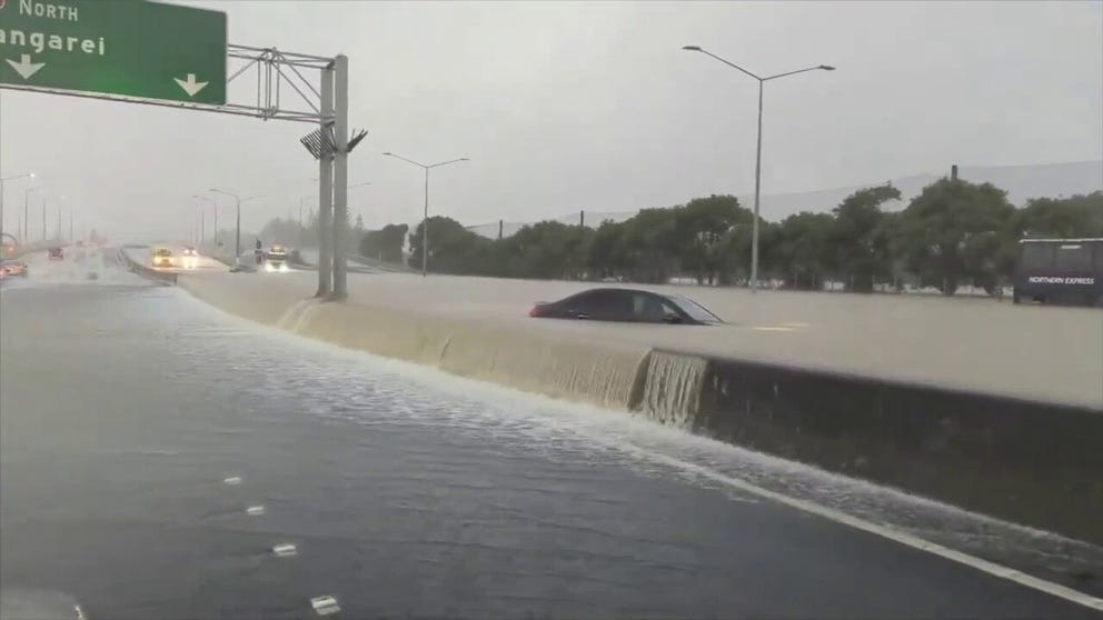 Extreme flooding in Auckland, New Zealand, followed near record rainfall on Friday, January 27, swamping roads and leading to an emergency declaration for the city. Video by Christo Montes shows several dramatic scenes, including a lane of State Highway 1 overflowing with water.