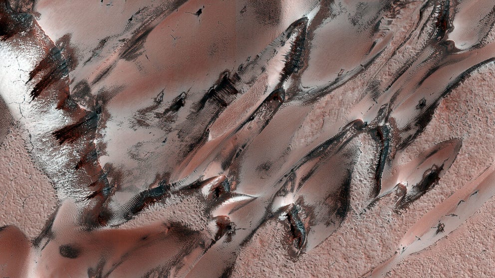 It's not just Earth that boasts snowfall. Mars gets snow sometimes too, only there, it's frozen carbon dioxide, not water. Peek at some of the "snowy" scenes from our distant planetary neighbor.
