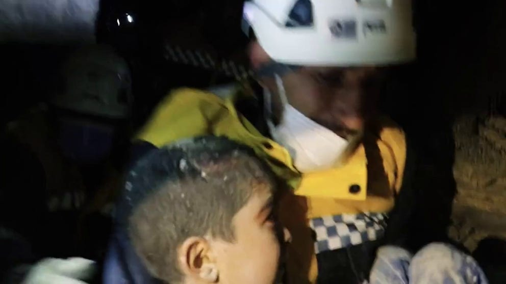 Syria Civil Defence released video of two girls being pulled from the rubble of their collapsed home in Jindares, Syria, on Wednesday.