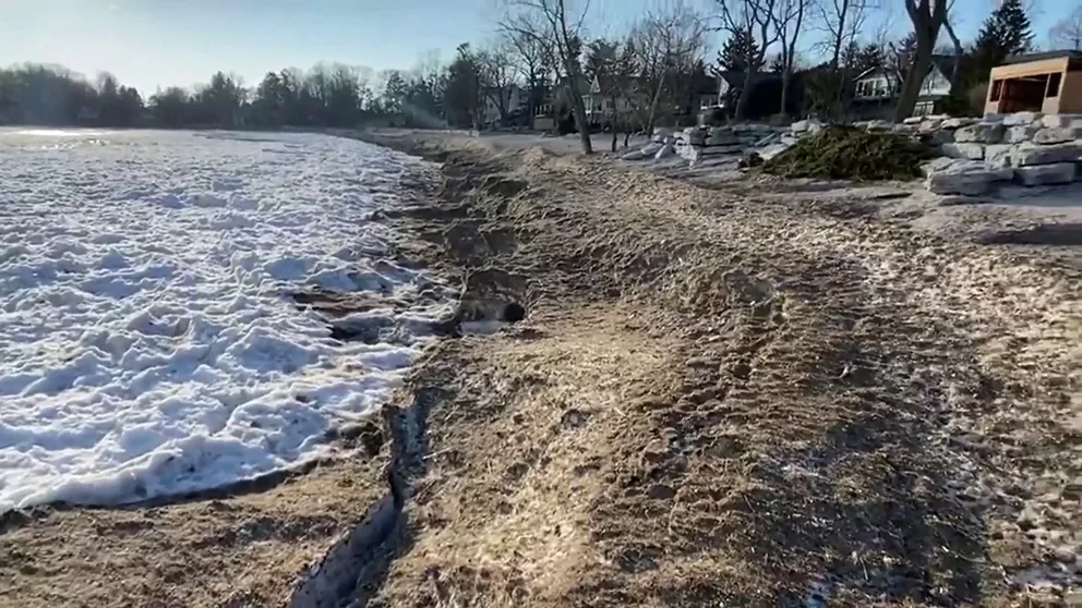 A video shot on Crystal Beach, Ontario shows a brown, sandy beach meeting the icy waters of Lake Erie. All five of the lakes are experiencing low ice cover this year. (Courtesy: @fishinniagara / WEATHER TRAKER /TMX)