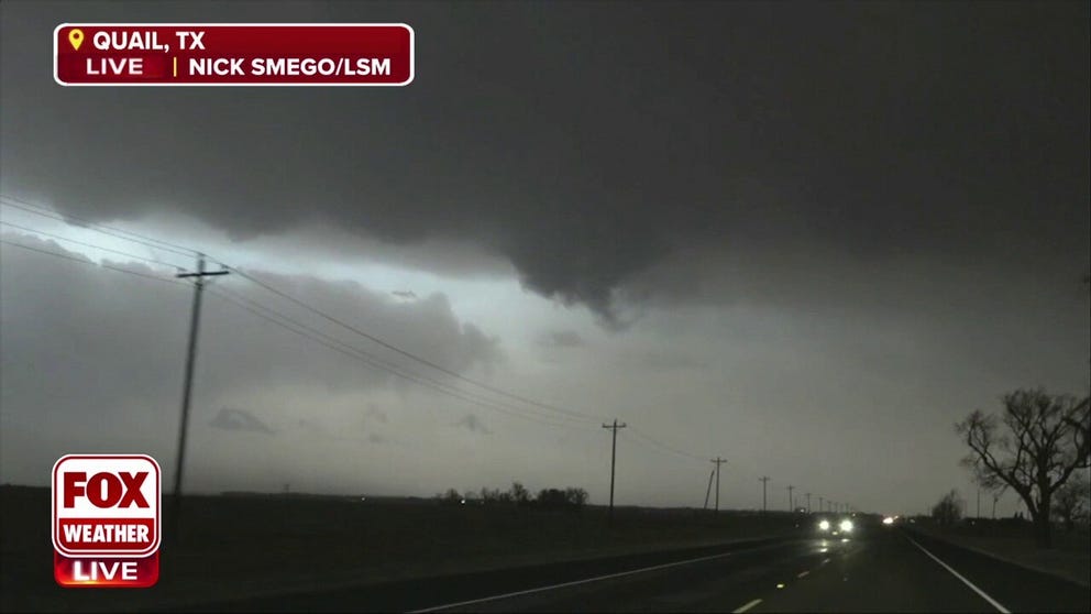 Storm chasers across the Plains are watching lowering skies, downpours and high winds rocking cars on the highway.