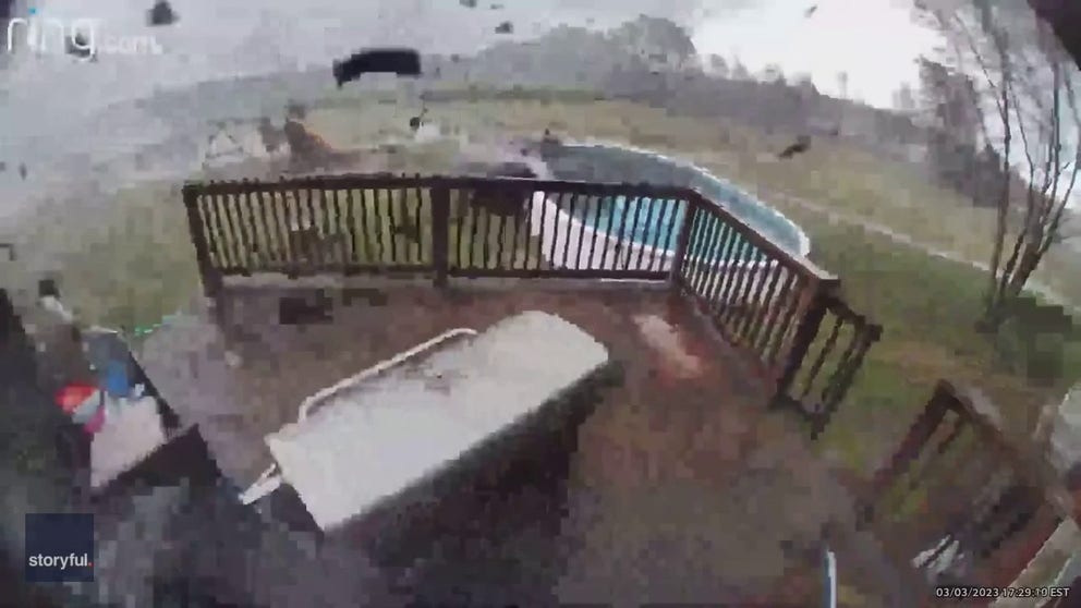 Home security cameras captured the intense moment a tornado tore across a backyard in Ohio on March 3, tossing patio furniture around like toys and nearly destroying a deck.
