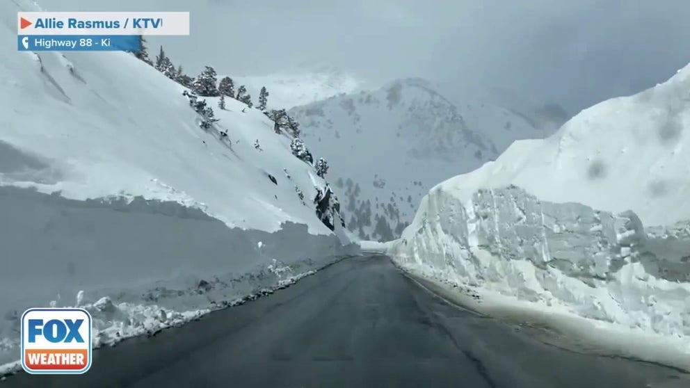 Snow walls tower over Highway 88 outside of Kirkwood, California. Many parts of the Sierra Nevada remain buried in more than 10 feet of snow. (Credit: Allie Rasmus/ KTVU)
