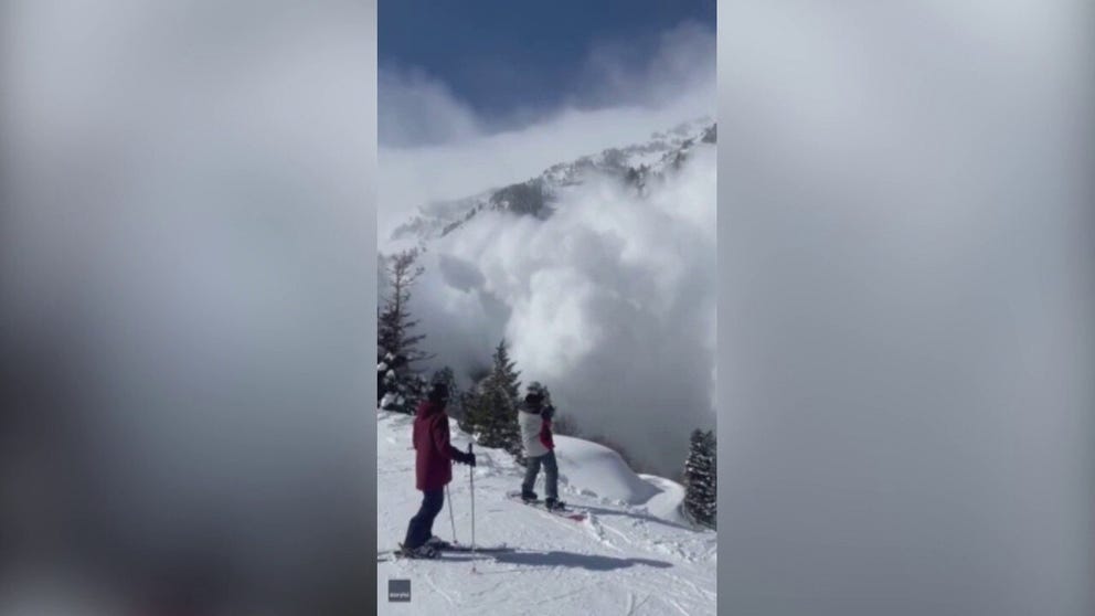 Video shows a group of skiers witnessing a large avalanche sweeping down Mount Timpanogos outside the Sundance Resort in Utah on Monday and enveloping them in a cloud of snow.