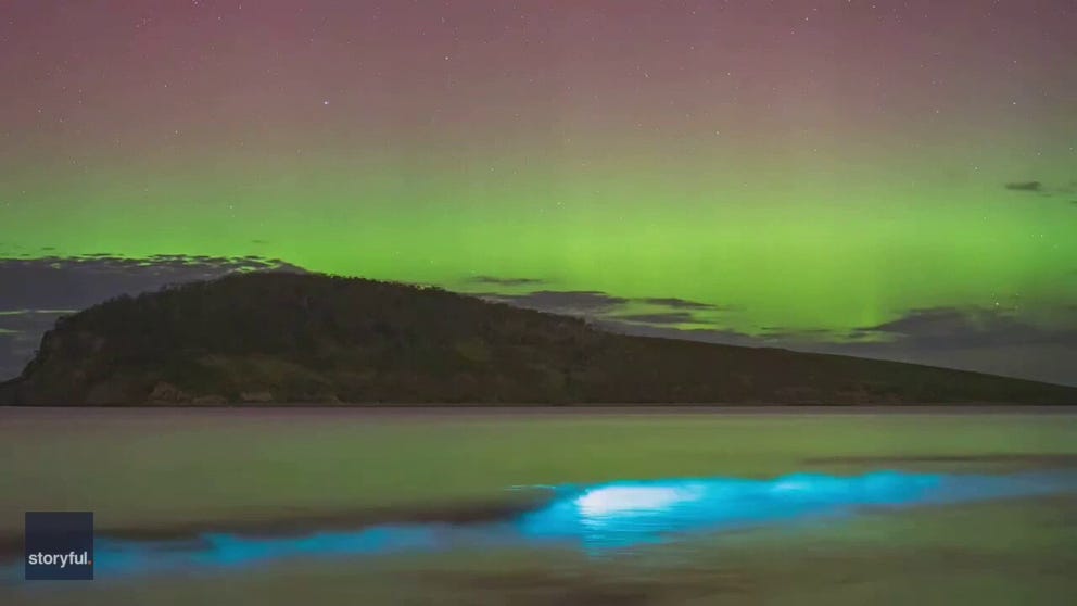 A photographer captured time lapse video of a dazzling aurora lighting up the sky above bioluminescent waves in the Greater Hobart area, Tasmania, on February 16.