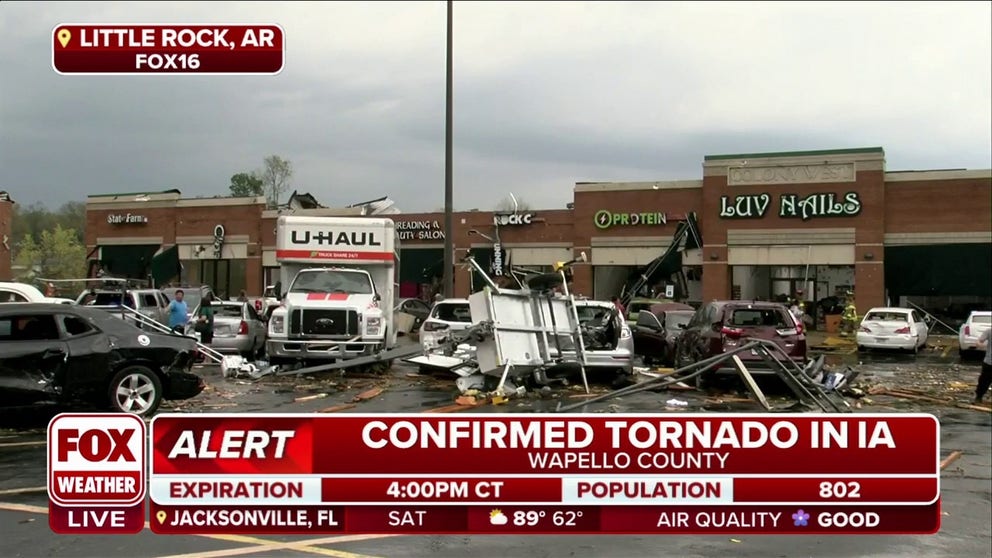 Tornado-warned storm damages vehicles and buildings in Little Rock, Arkansas on Friday.