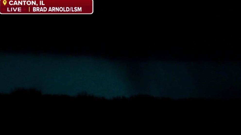 NWS confirmed that a damaging tornado was moving through Canton, Illinois, Tuesday evening. Storm tracker Brad Arnold provides a live view. 