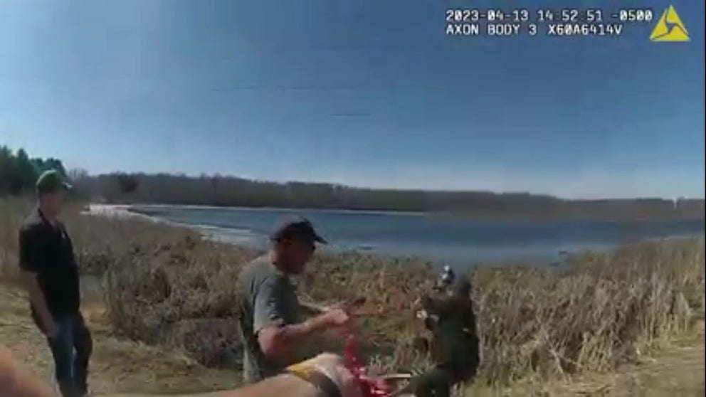 Police bodycam footage shows a sheriff’s deputy and members of the public pulling the two women and their dog from the water on April 13, 2023. (Courtesy: Chisago County Sheriff's Office/Facebook)