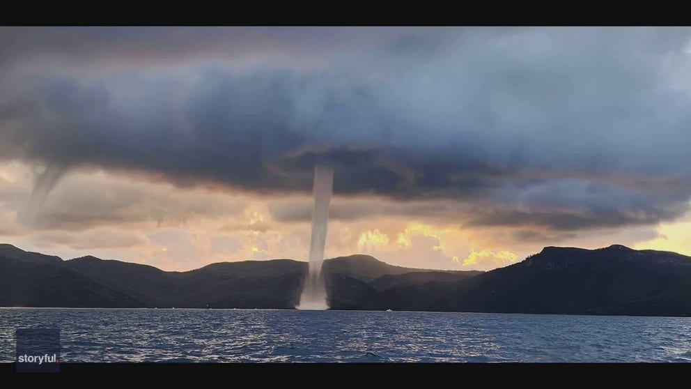 An Australian fisherman was able to capture a stunning video of twin waterspouts spinning near the Whitsunday Islands in Queensland on April 12.