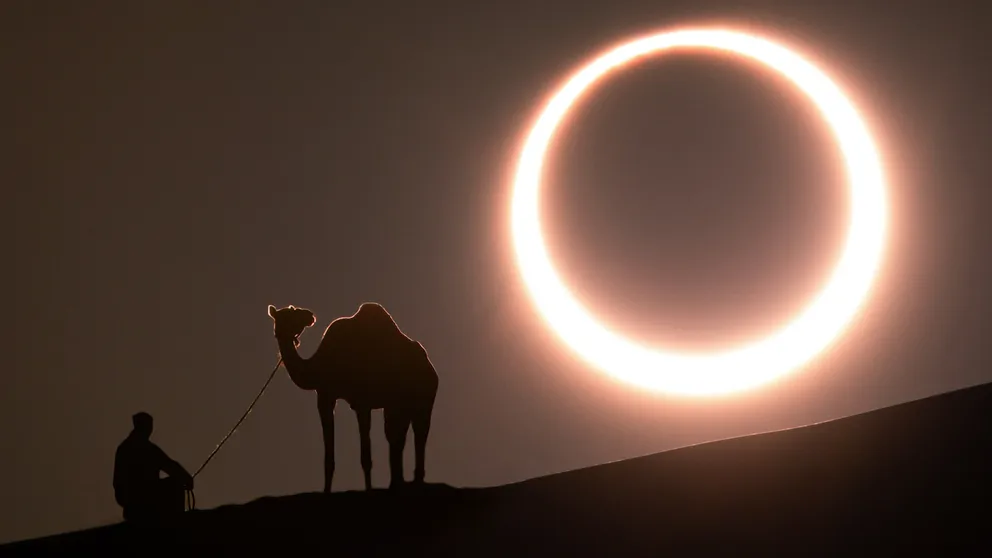During a total or annular solar eclipse, the moon passes in front of the sun and casts its shadow upon the Earth's surface. 