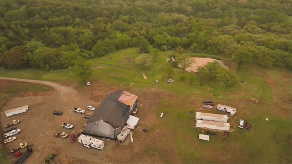 Drone video taken above Trenton, Missouri, shows a trail of destruction after apparent tornadoes and large hail damaged homes and injured cattle on Saturday.