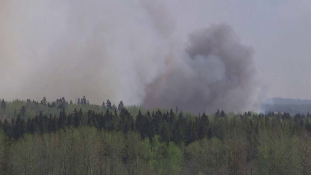 Wildfires Rage Across Alberta Forcing More Than 24,000 To Flee Their ...