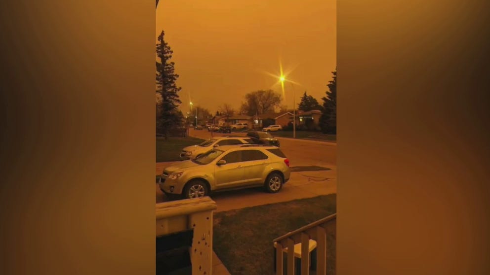Almost 30,000 people were forced to evacuate their homes in Alberta, Canada, as wildfires continued to burn in the province on Monday, May 8. Footage shows the sky darken and become orange in Grande Prairie on Friday evening.