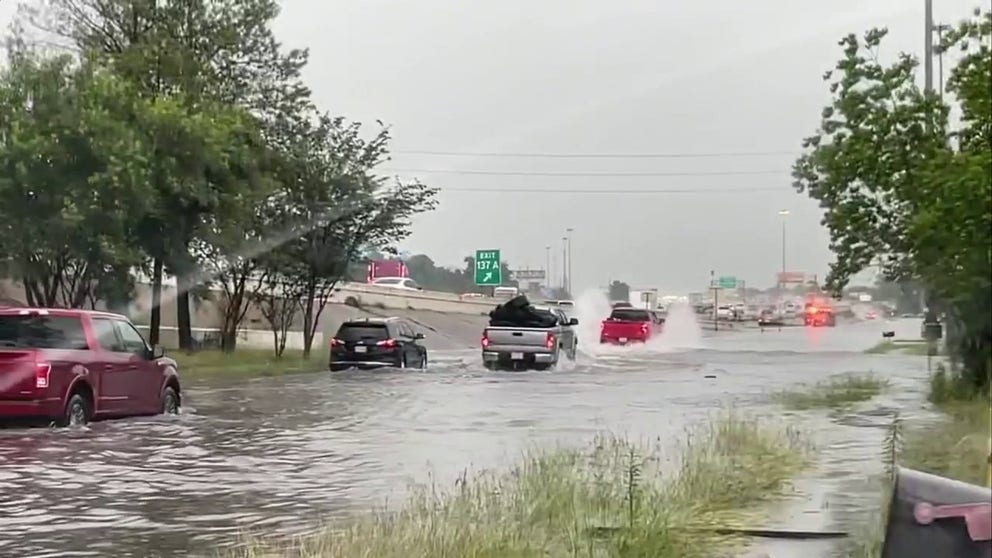 Cars entering and exiting the highways have stalled on the side of the road due to the amount of flooding in Houston. Some trucks and larger vehicles were able to pass through as others remained on the street. 