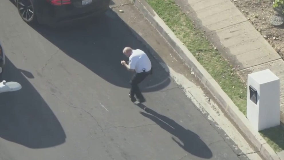 Video from a news helicopter captured the dramatic moments where a man collapsed to the ground after he was attacked by bees in a Los Angeles neighborhood.