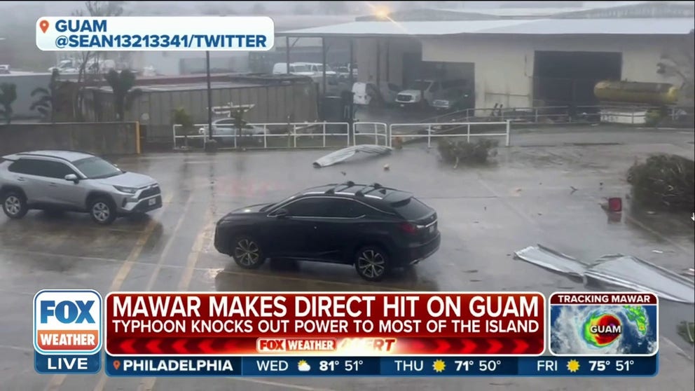 Typhoon Mawar slammed into Guam on Wednesday as destructive winds from the direct hit knocked out power to most of the island.