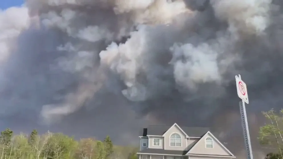 Tense video shows thick, black smoke filling the sky above Nova Scotia, Canada. Thousands of people have been forced to evacuate and hundreds of buildings have been damaged or destroyed by the flames.