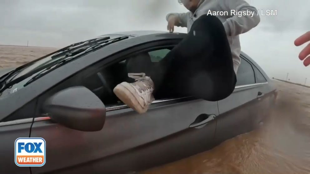 Dramatic moments unfolded on camera Thursday as a storm chaser helped a young man in need while his car began to float away. It happened on impassable Highway 87 near O'Donnell and south of Lubbock, Texas.