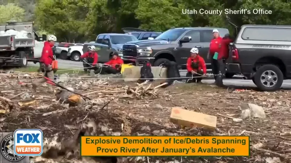 Crews in Utah use explosives to blow away an ice bridge that formed over the Provo River after a huge avalanche in January.