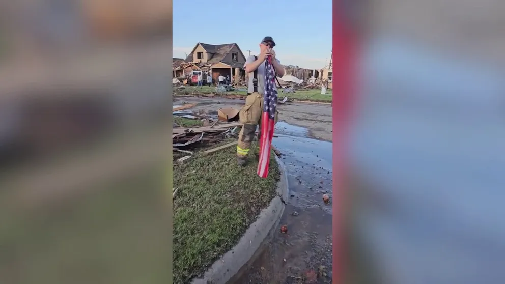 Army veteran and Booker, Texas, Fire Chief Andrew Skipper stopped to retrieve an American flag from the debris after the deadly tornado outbreak in Perryton on Thursday, June 15, 2023.