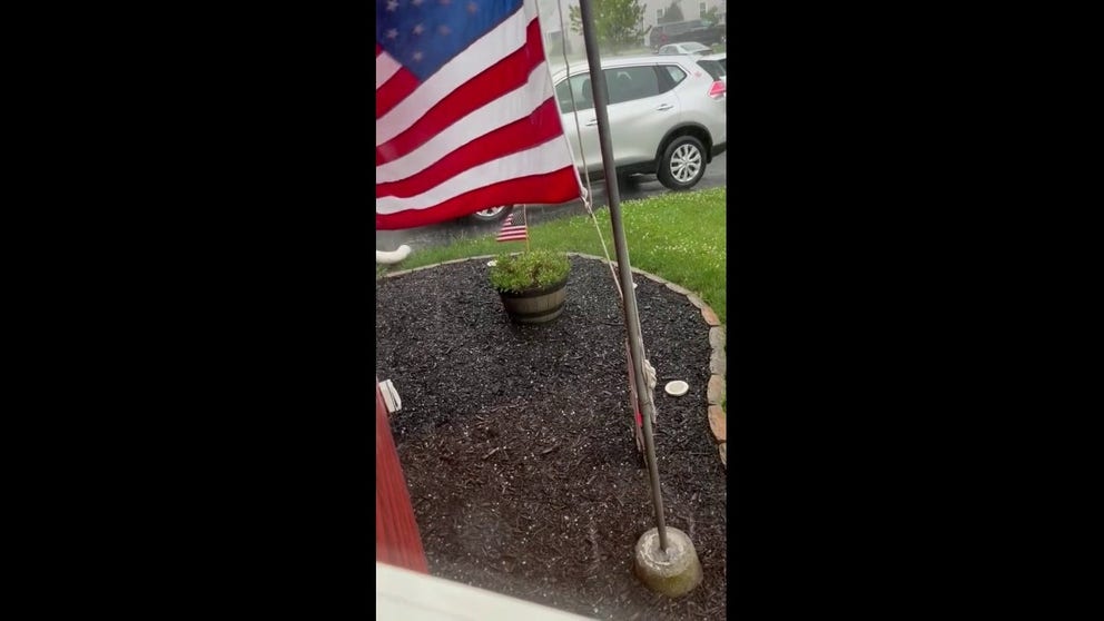 Residents in Hellertown, PA, watched as hail fell from severe storms Monday afternoon. 