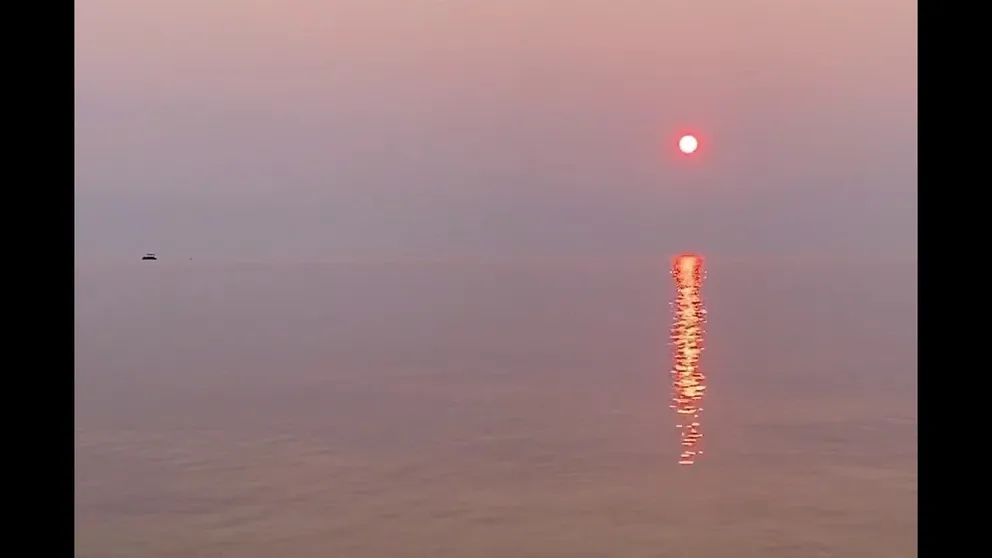 Canadian wildfire smoke created a hazy red-orange sky over Lake Michigan on June 23 at the Michigan-Huron watershed. Wildfire smoke is causing poor air quality in the Great Lakes this week.