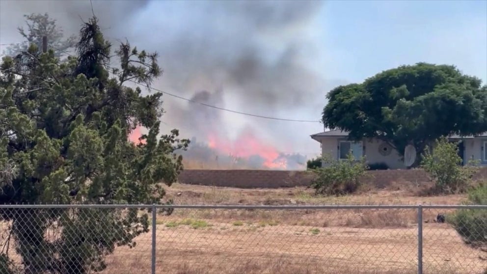 A fast-moving wildfire in Riverside County destroyed several structures and forced evacuations on Tuesday as firefighters flooded the region with resources to try to tame the flames.