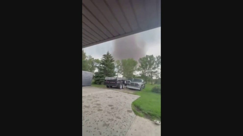  A large tornado touched down in Alberta, Canada on Saturday and destroyed several buildings along its path. Videos from the area show the tornado spinning across the landscape and dropping large hail.