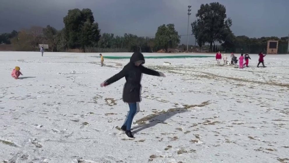 Snow fell Monday in Johannesburg for the first time in more than a decade, giving some children their first snow experience of their lives. (Video courtesy: Reuters)