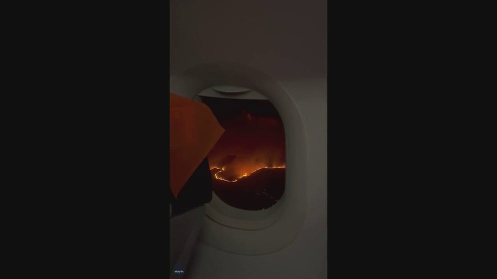 Passengers on an airplane headed for London spotted massive wildfires burning in Greece.