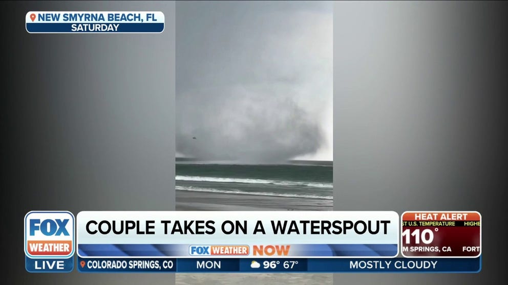 A couple on New Smyrna Beach, Florida was shocked when an apparent tornado surrounded them then moved offshore as a waterspout.
