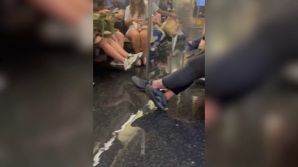 A video show at the New Utrecht Ave station in Brooklyn shows water pouring into a subway car, as New York City was issued a flash flood warning on July 25, 2023.