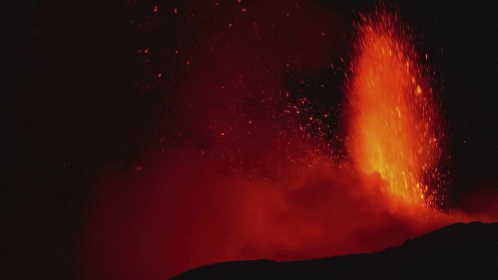 Italy's Mount Etna put on quite a show early Monday morning. The volcano spewed glowing lava and belched ash that closed nearby airports.