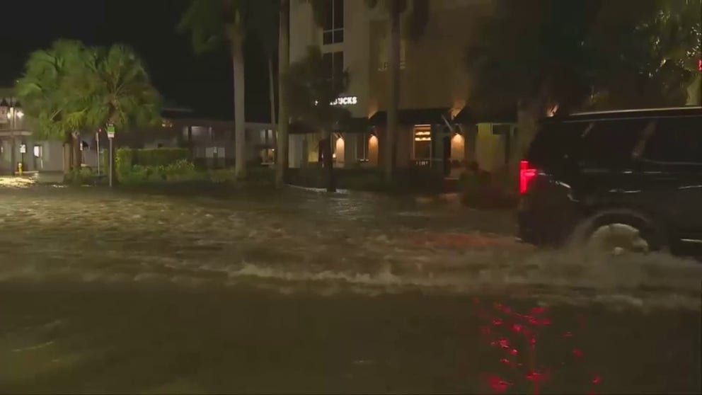 Flooding was reported in Clearwater Beach, Florida, as Hurricane Idalia approached the state's Gulf Coast, and video from the area shows vehicles driving over water-covered roadways.