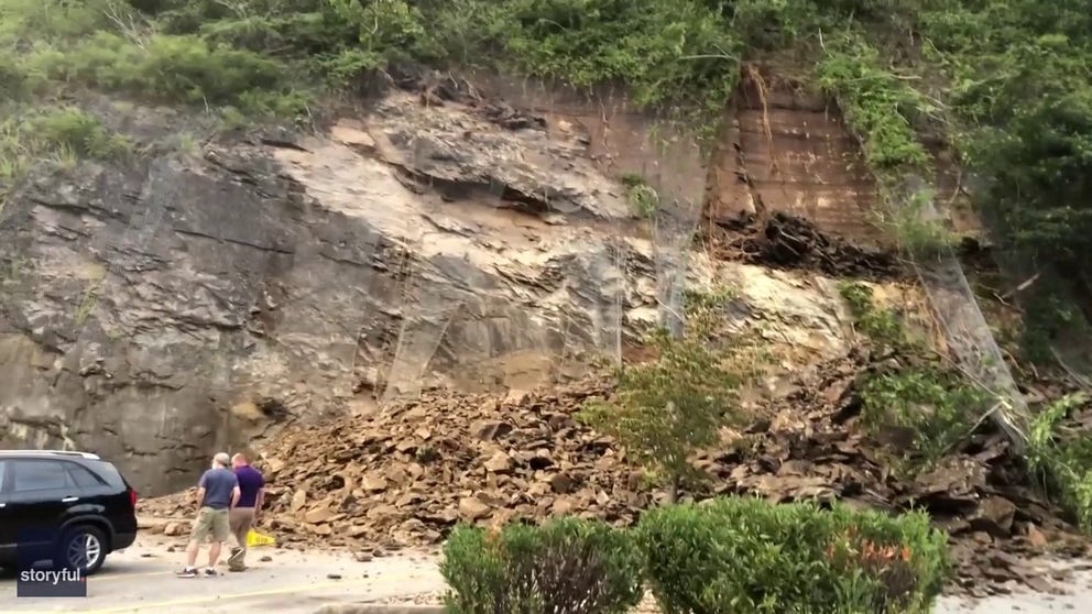 Footage shows a rockslide crashing down in a Food City parking lot in Gatlinburg on Friday. (Courtesy: Chrissie McCormick via Storyful)