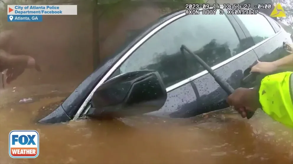 Police and firefighters in Atlanta were able to rescue a man who became trapped in his vehicle when it was surrounded by water during significant flooding amid torrential rain on September 14, 2023.