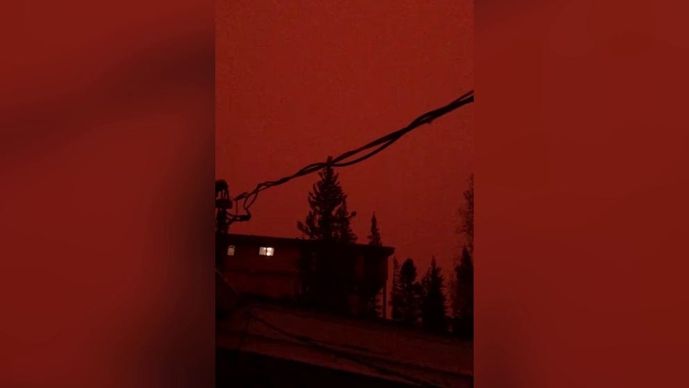 A video posted to X, formerly Twitter, on Saturday shows how wildfires turned the sky over Yellowknife in the Canadian province of the Northwest Territories a dark orange color. (Courtesy: Ryan of the North via Storyful)