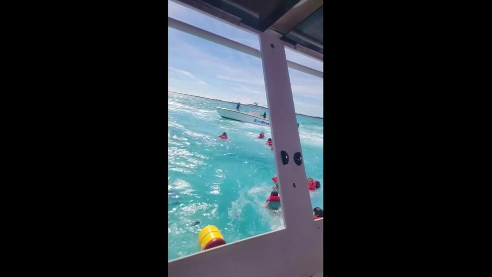 Video shows the moment terrified passengers begin to leap from a sinking boat to safety after it began to take on water while heading to the popular tourist destination Blue Lagoon Island in the Bahamas.