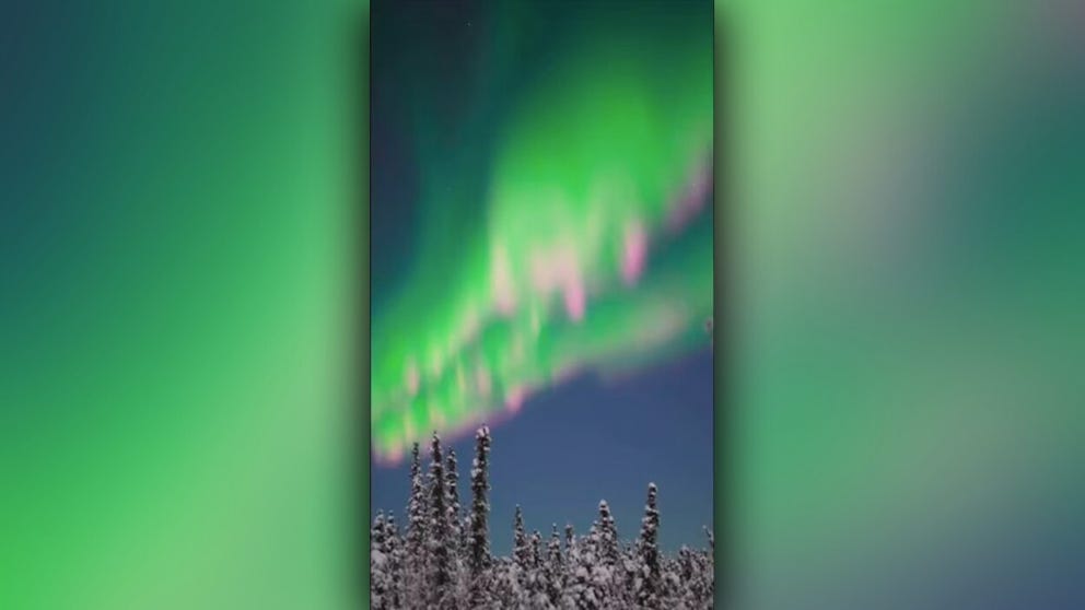 Fairbanks, Alaska sky watchers were treated Sunday night to a colorful aurora dancing over the freshly fallen snow.