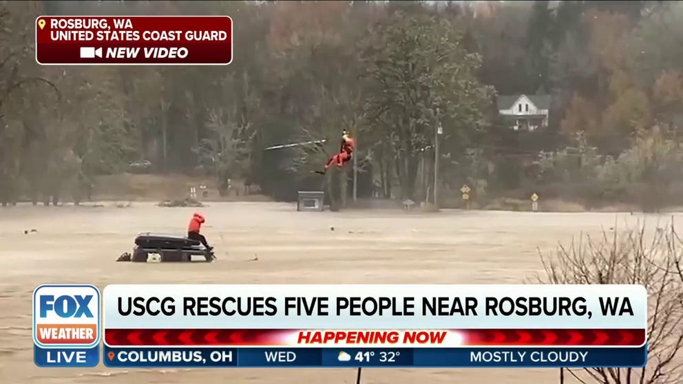 Vehicles became submerged in floodwater near the Oregon-Washington state line on Tuesday. The Coast Guard reported at least five people were rescued