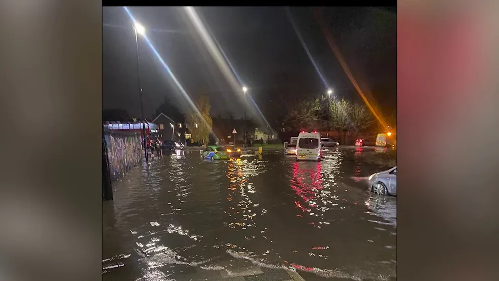 Videos shot on Tuesday night show flood water turning a roundabout in the East London neighborhood of Abbey Wood into a waterway. (Courtesy: Charlie Robery via Storyful)