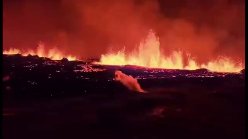 The Icelandic Civil Defense shared dramatic video of lava shooting from a volcanic fissure near the town of Grindavik after a volcano erupted on Monday night.