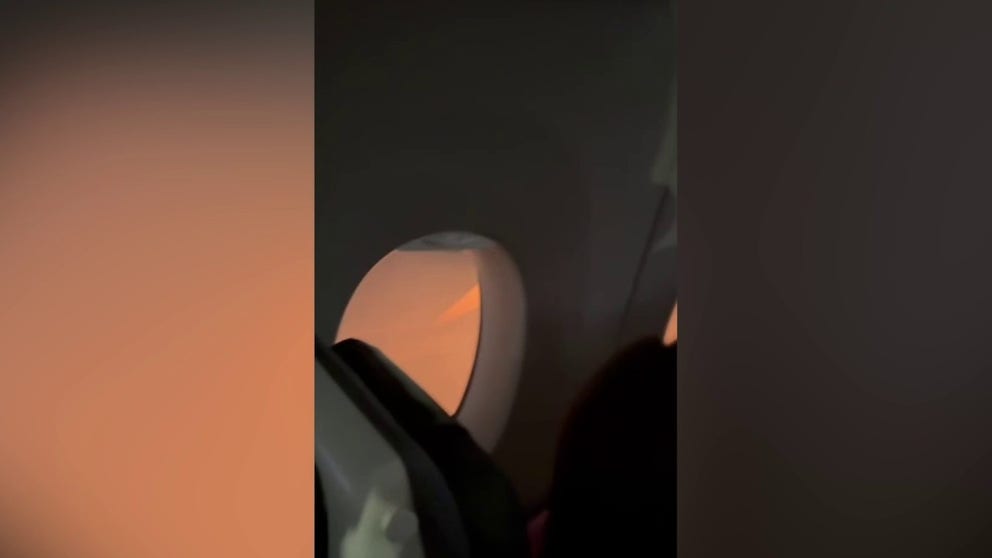 Video shot on Tuesday shows passengers on a Japan Airlines airplane after it collided with an aircraft after landing at Haneda Airport in Tokyo. (Courtesy: Jonas Deibe / LOCAL NEWS X /TMX)